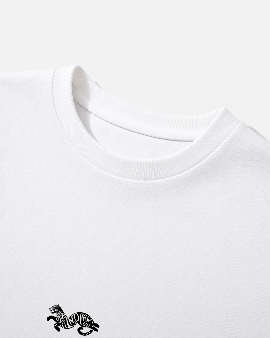 Close-up of the ribbed crew collar on the white Dear India oversized t-shirt