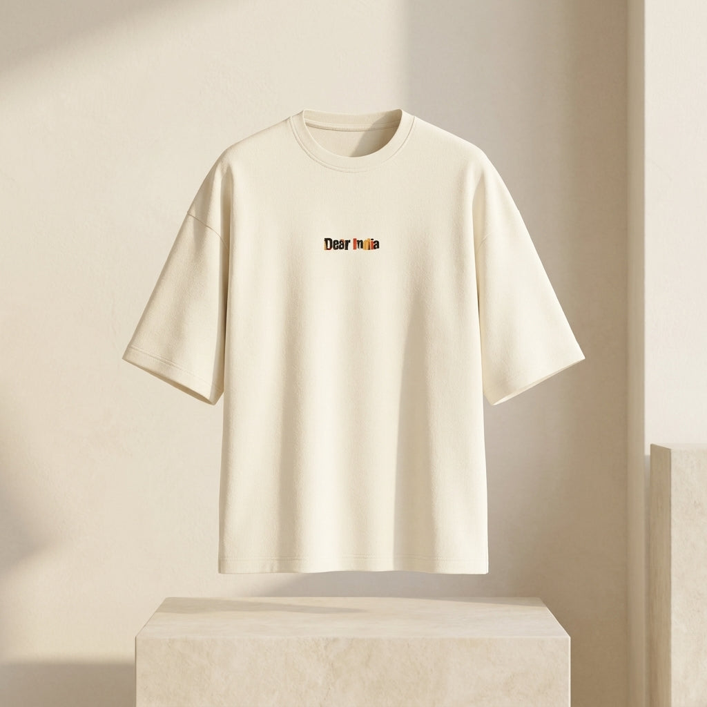 Beige t-shirt with 'Dear India' text on a light beige background