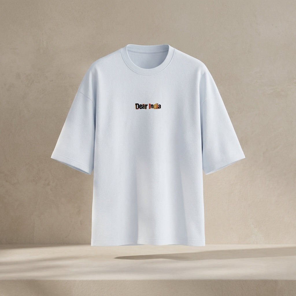 White t-shirt with 'Dear India' text on a beige background