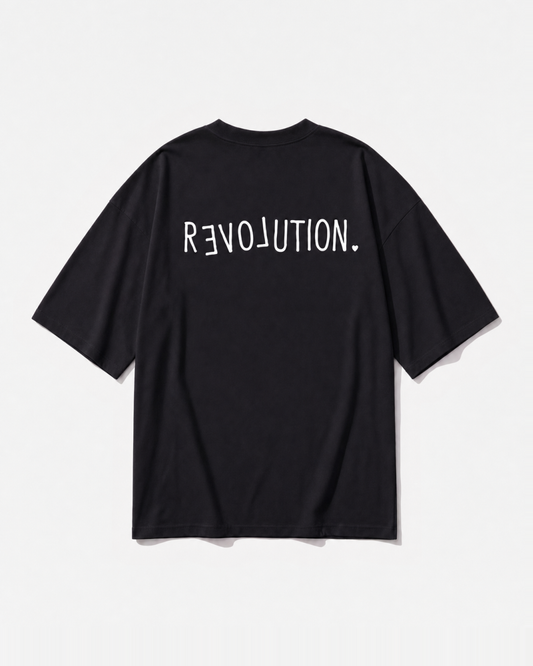 A 'Rloveution' revolution-and-love graphic printed across the back of a black oversized t-shirt by Dear India