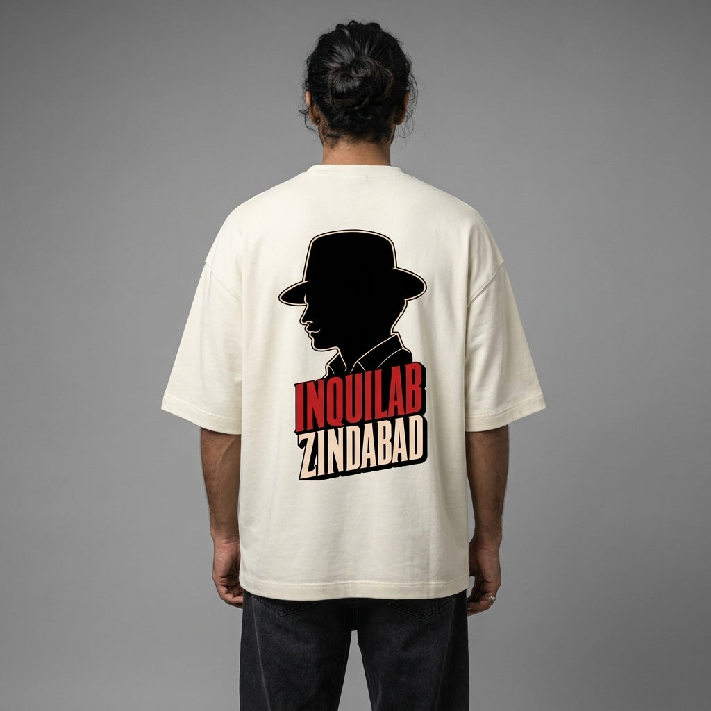 Person wearing a white t-shirt with a graphic and text on the back against a gray background