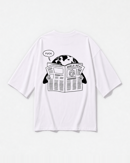 A newspaper-style 'World News' graphic printed across the back of a white oversized t-shirt by Dear India